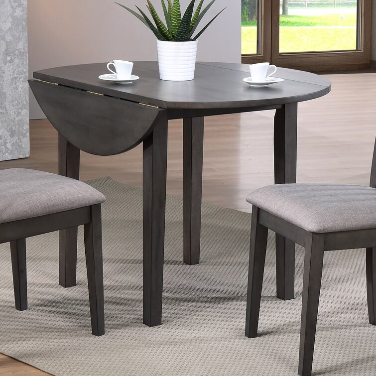 Dutra extendable outlet dining table